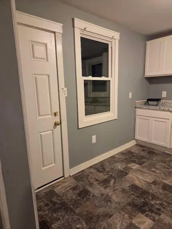 a view of a kitchen that has a sink and a stove