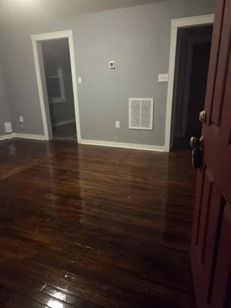 a view of hallway with wooden floor