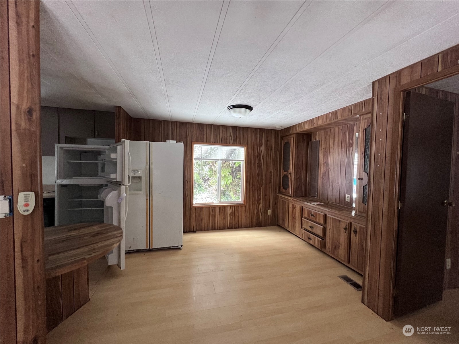 2408 Newberg Road Snohomish, WA 98290 - Photo 23 of 32 a view of hallway with cabinets and refrigerator