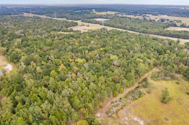 a view of a field with an outdoor space
