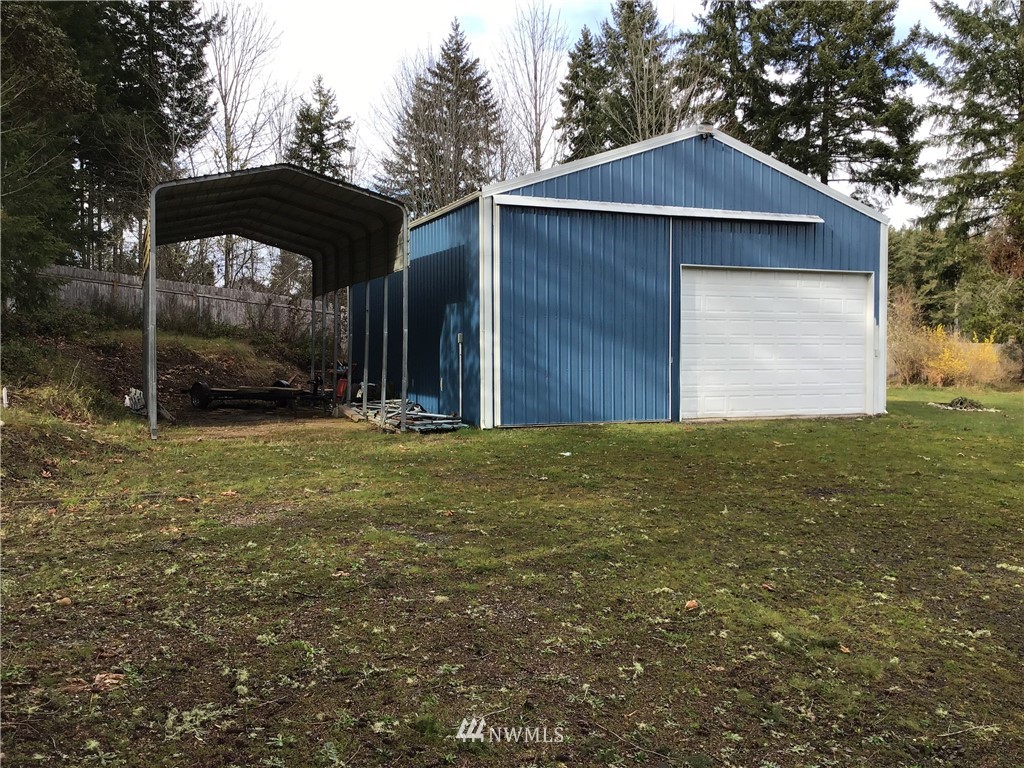 761 East Victor Road Belfair, WA 98528 - Photo 22 of 33 a front view of a house with garden