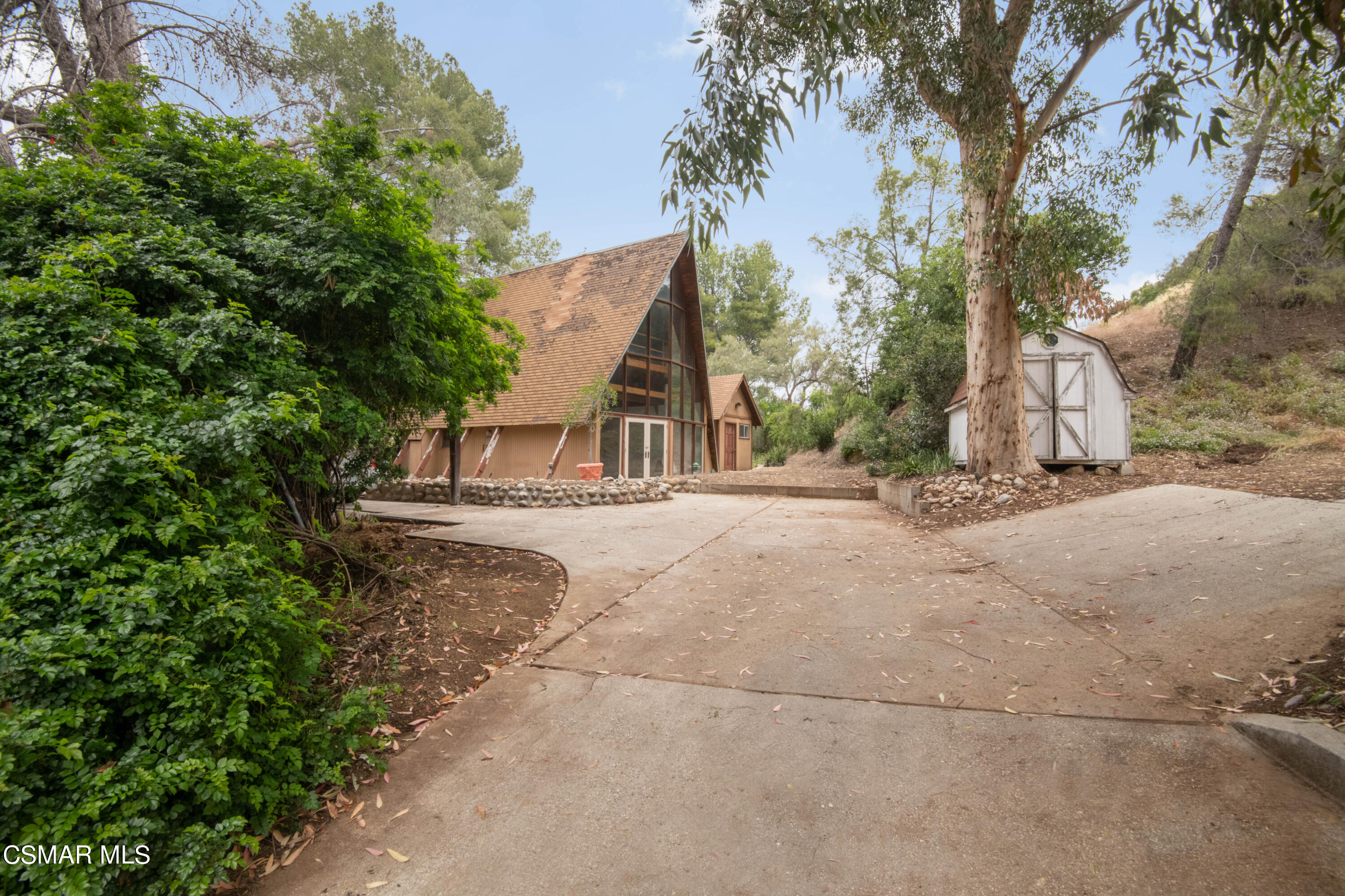 1024 Black Canyon Road Simi Valley, CA 93063 - Photo 3 of 31 a view of a house with large trees