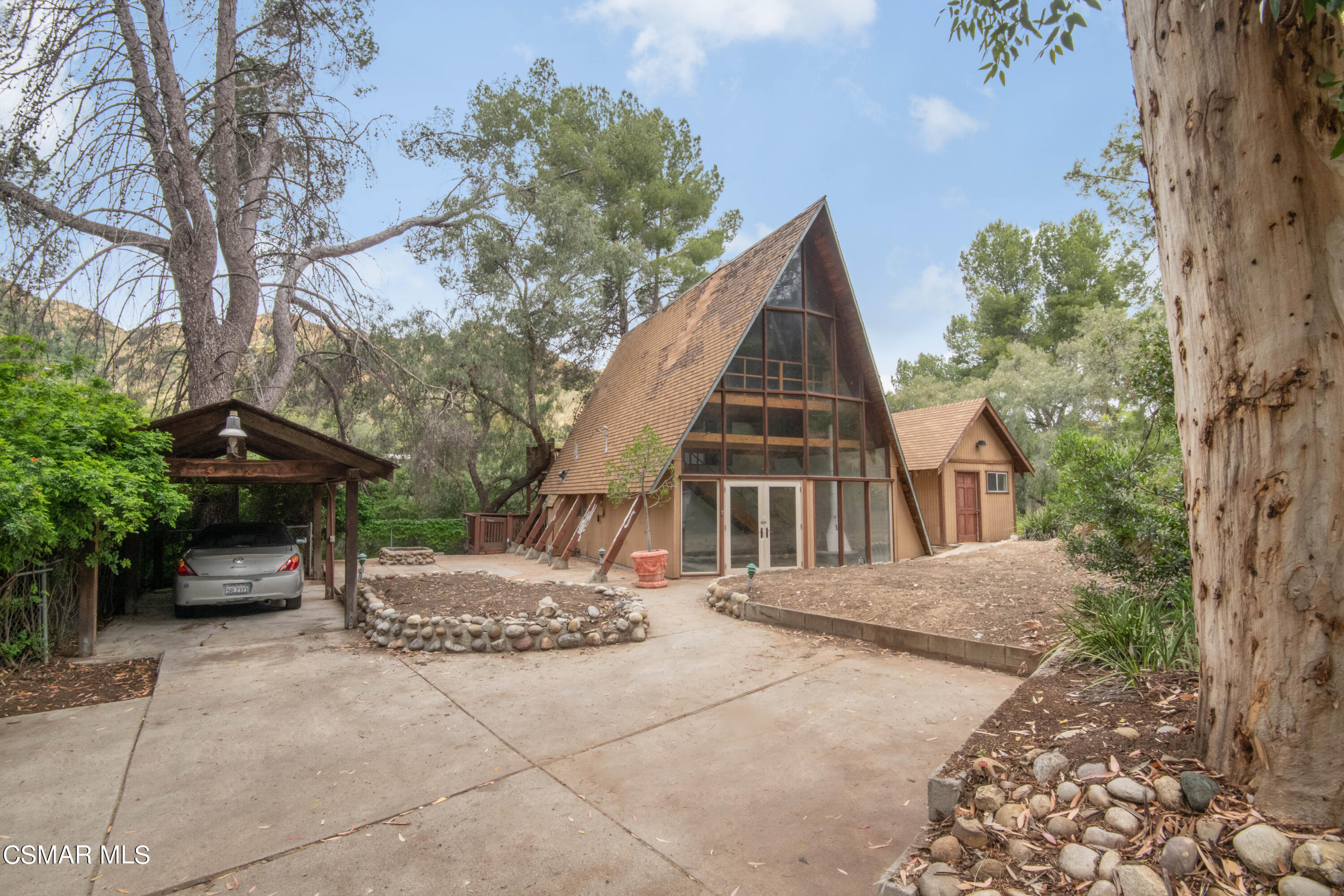 1024 Black Canyon Road Simi Valley, CA 93063 - Photo 4 of 31 a view of a house with a yard