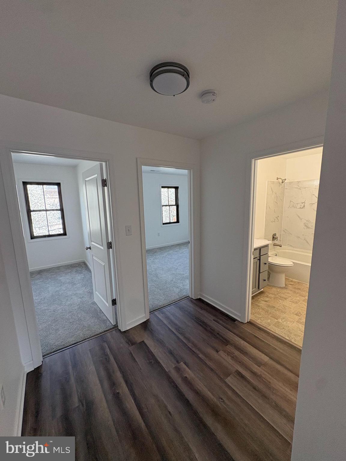 106 West All Saints Street, Unit B2 Frederick, MD 21701 - Photo 11 of 16 a view of livingroom with hardwood floor and hallway