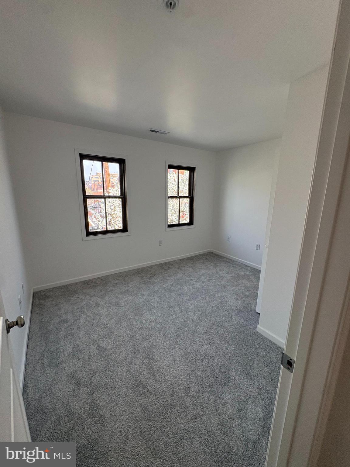 106 West All Saints Street, Unit B2 Frederick, MD 21701 - Photo 12 of 16 an empty room with windows
