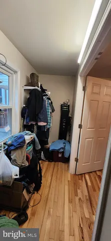 a room with wooden floor and furniture