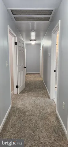 a bed room with a bed and a television