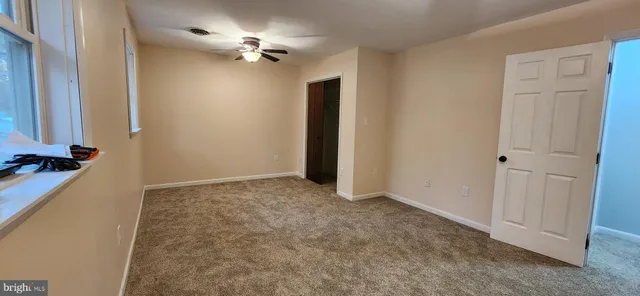 a bathroom with a double vanity sink mirror and shower