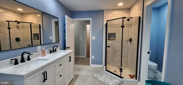 a bathroom with a bathtub and a shower