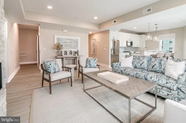 a living room with furniture and a table