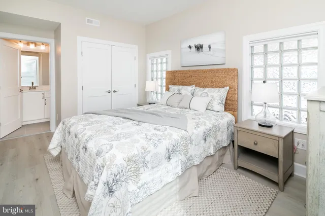 a large white bed in a white room