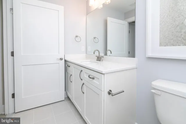 a utility room with cabinets washer and dryer