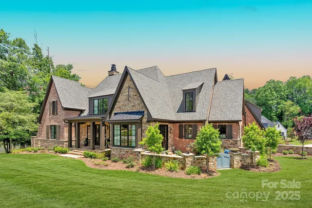 a front view of house and yard with green space