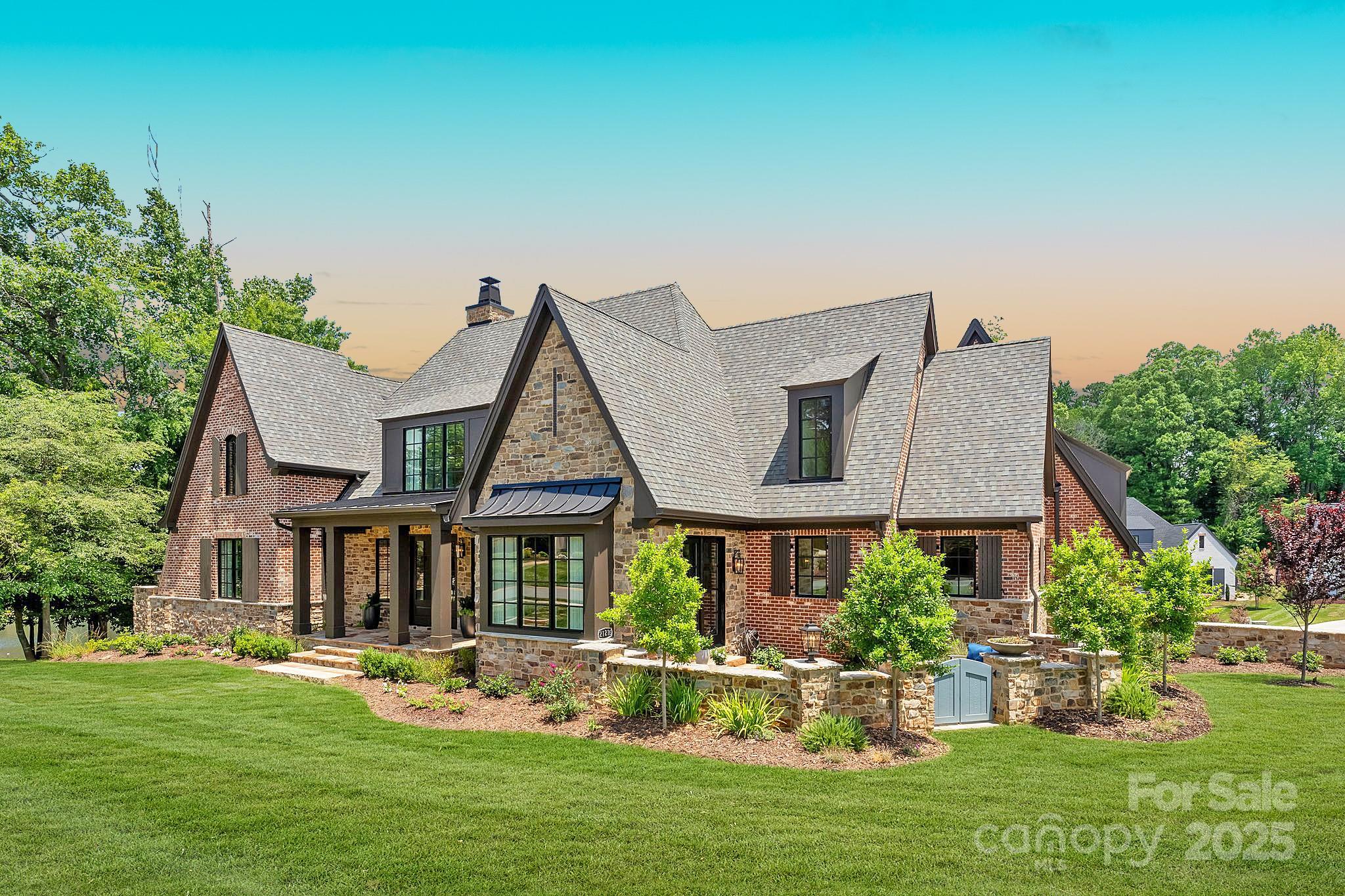 21216 Olde Quarry Lane Cornelius, NC 28031 - Photo 1 of 48 a front view of house and yard with green space