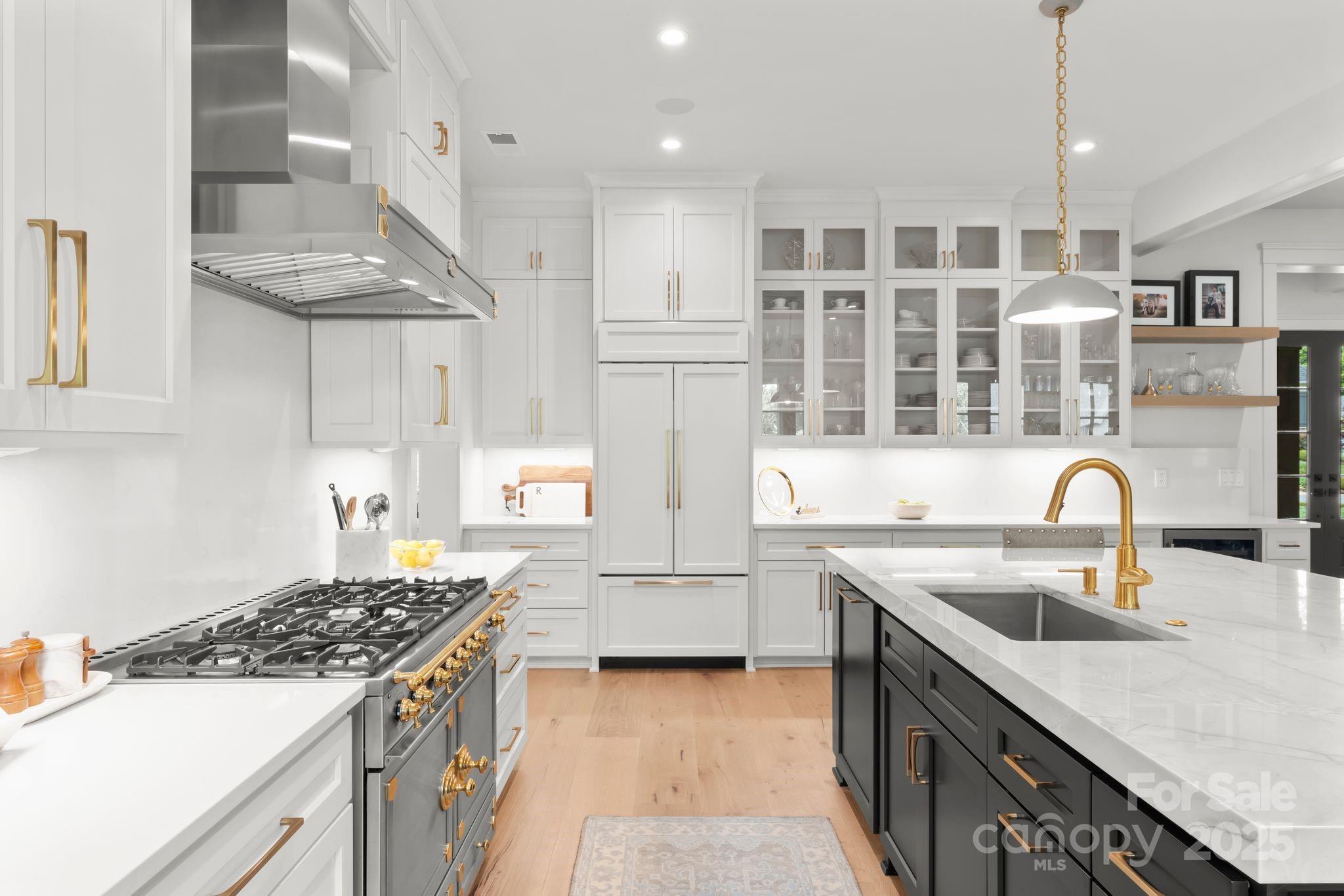 21216 Olde Quarry Lane Cornelius, NC 28031 - Photo 11 of 48 a kitchen with stainless steel appliances granite countertop a sink stove and refrigerator