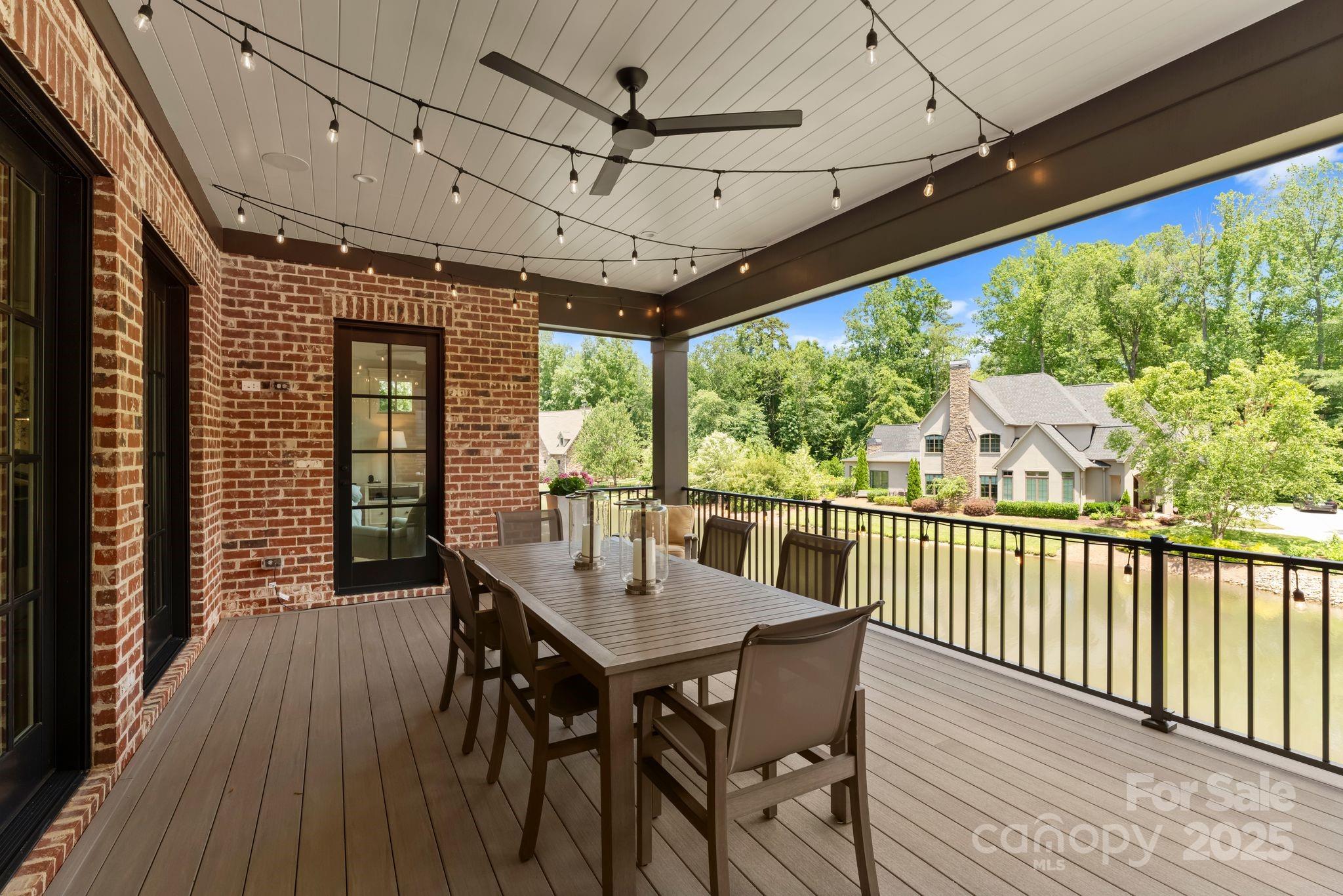 21216 Olde Quarry Lane Cornelius, NC 28031 - Photo 17 of 48 a view of a porch with furniture and wooden floor