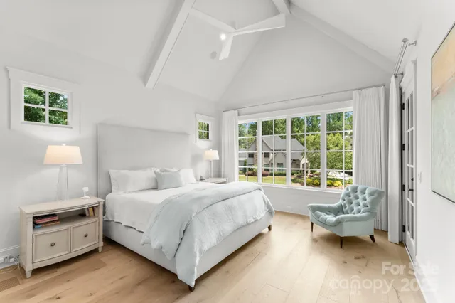 a bedroom with a bed and a night stand