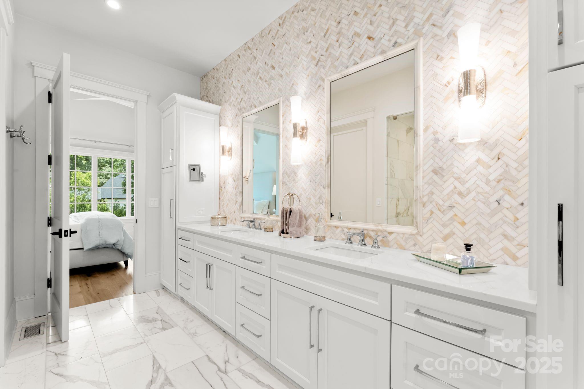 21216 Olde Quarry Lane Cornelius, NC 28031 - Photo 21 of 48 a en suite bathroom with a double sink and mirror