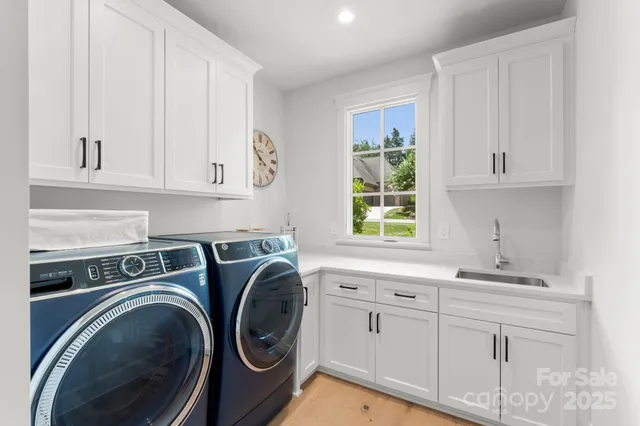a kitchen with sink and cabinets