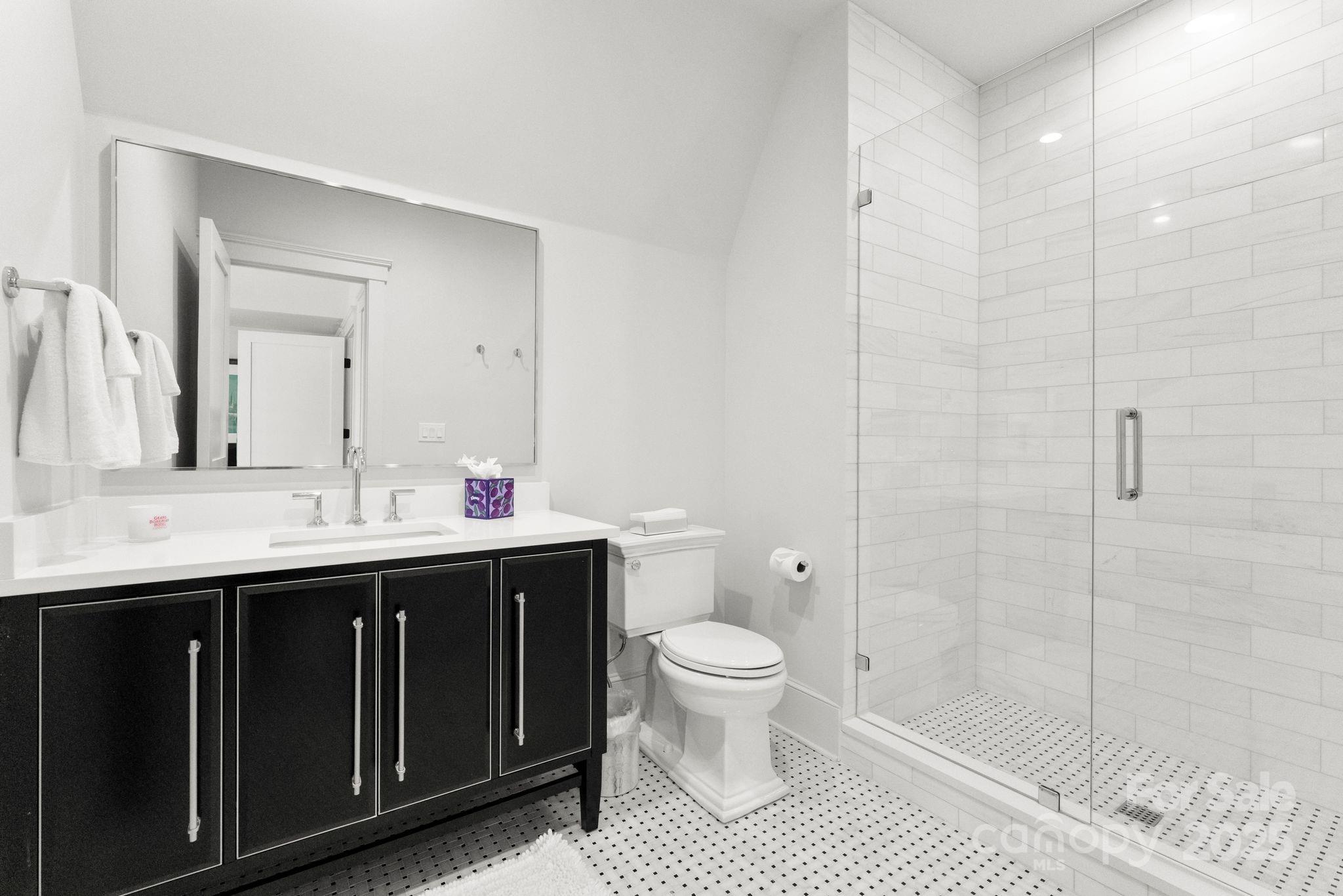 21216 Olde Quarry Lane Cornelius, NC 28031 - Photo 34 of 48 a bathroom with a sink a toilet and shower