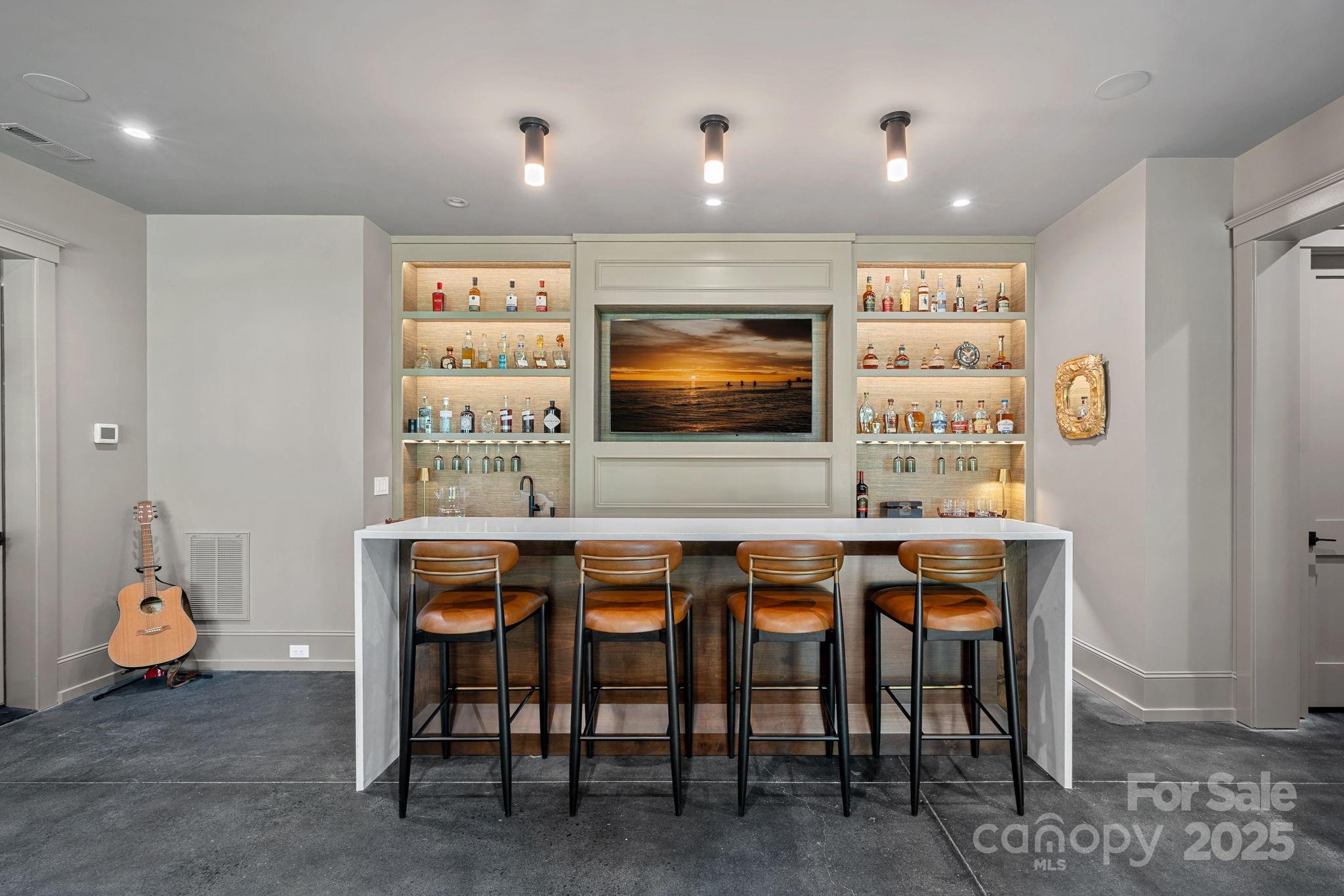 21216 Olde Quarry Lane Cornelius, NC 28031 - Photo 39 of 48 a kitchen with stainless steel appliances a dining table chairs and couches