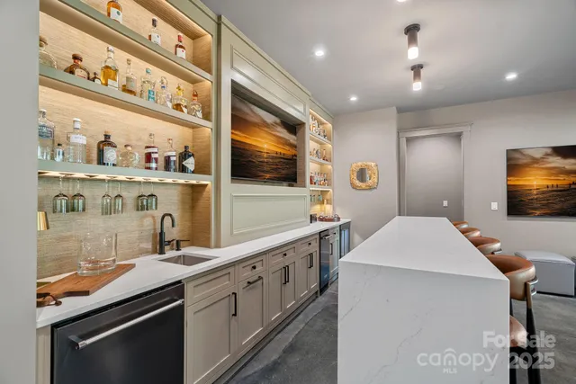 a kitchen with stainless steel appliances a stove a sink and a microwave