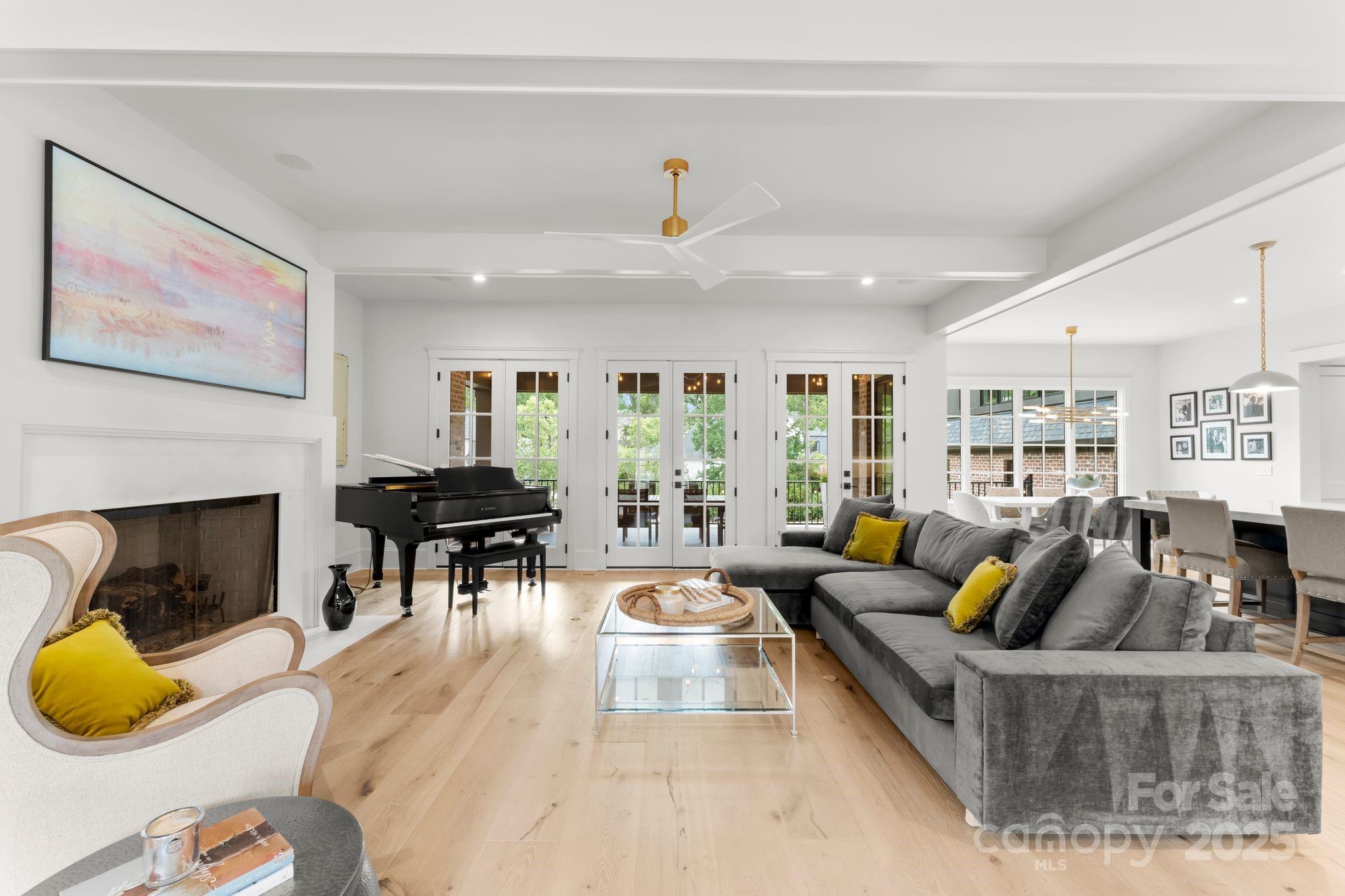 21216 Olde Quarry Lane Cornelius, NC 28031 - Photo 4 of 48 a living room with furniture and a fireplace