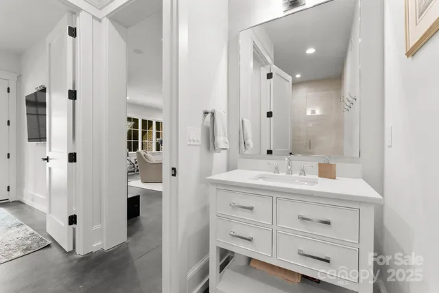 a bathroom with a double vanity sink mirror and shower
