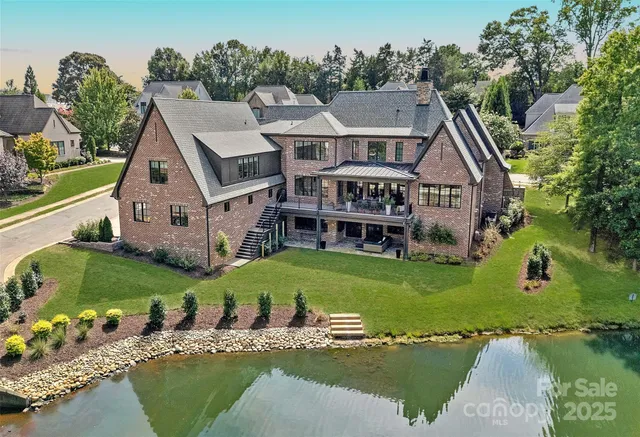 an aerial view of a house with outdoor space