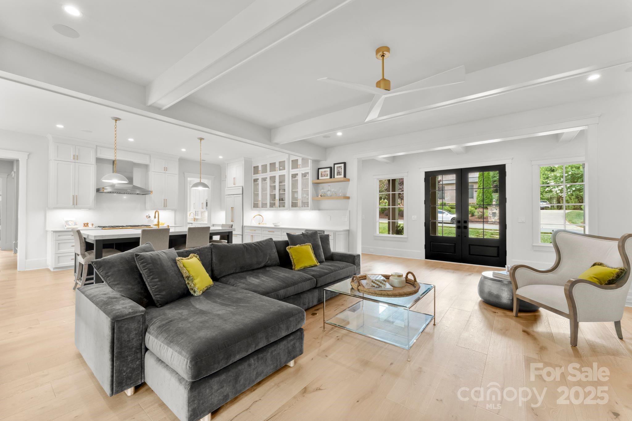 21216 Olde Quarry Lane Cornelius, NC 28031 - Photo 6 of 48 a living room with furniture and wooden floor