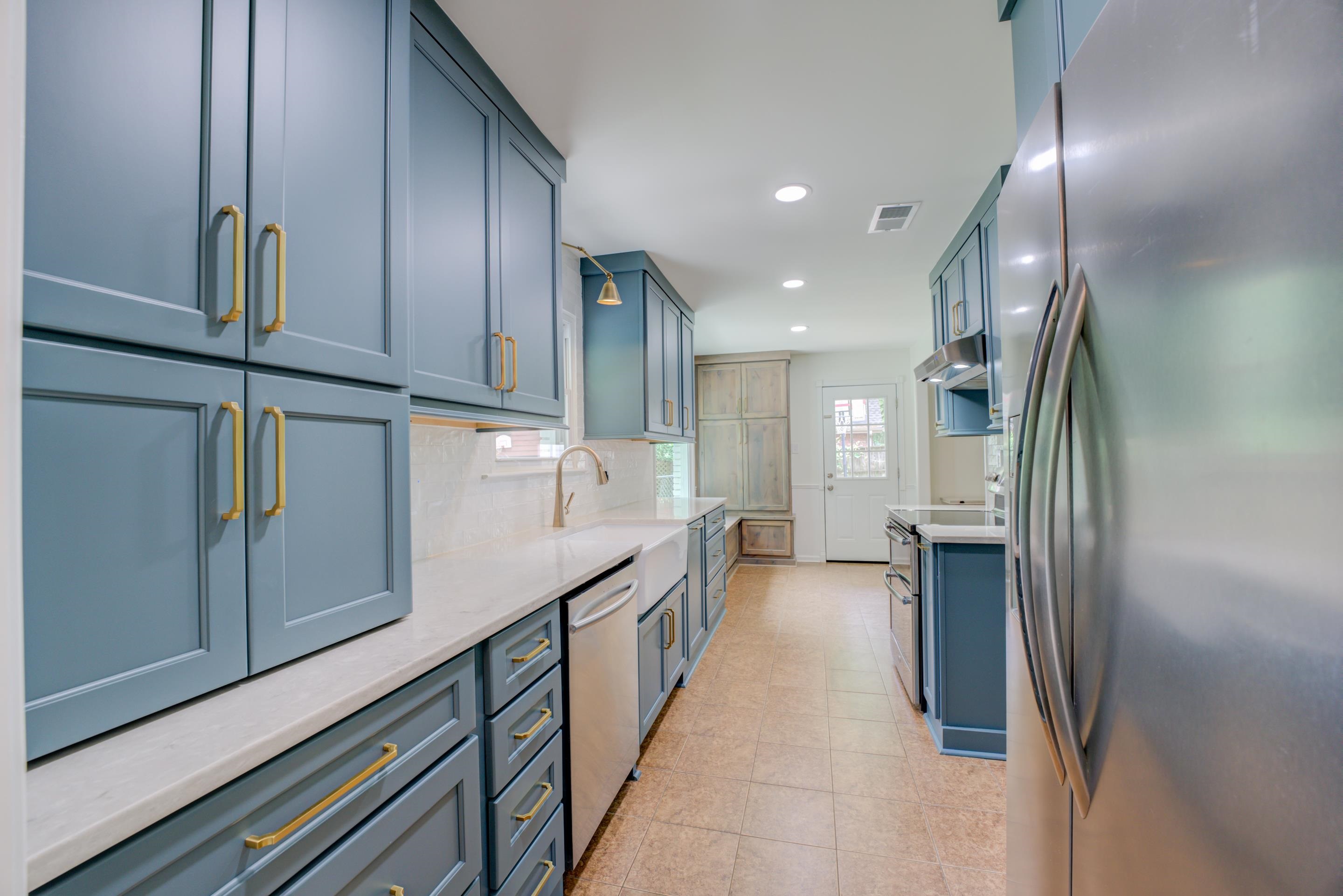 316 Dove Valley Road Collierville, TN 38017 - Photo 3 of 21 a kitchen with stainless steel appliances sink refrigerator and cabinets
