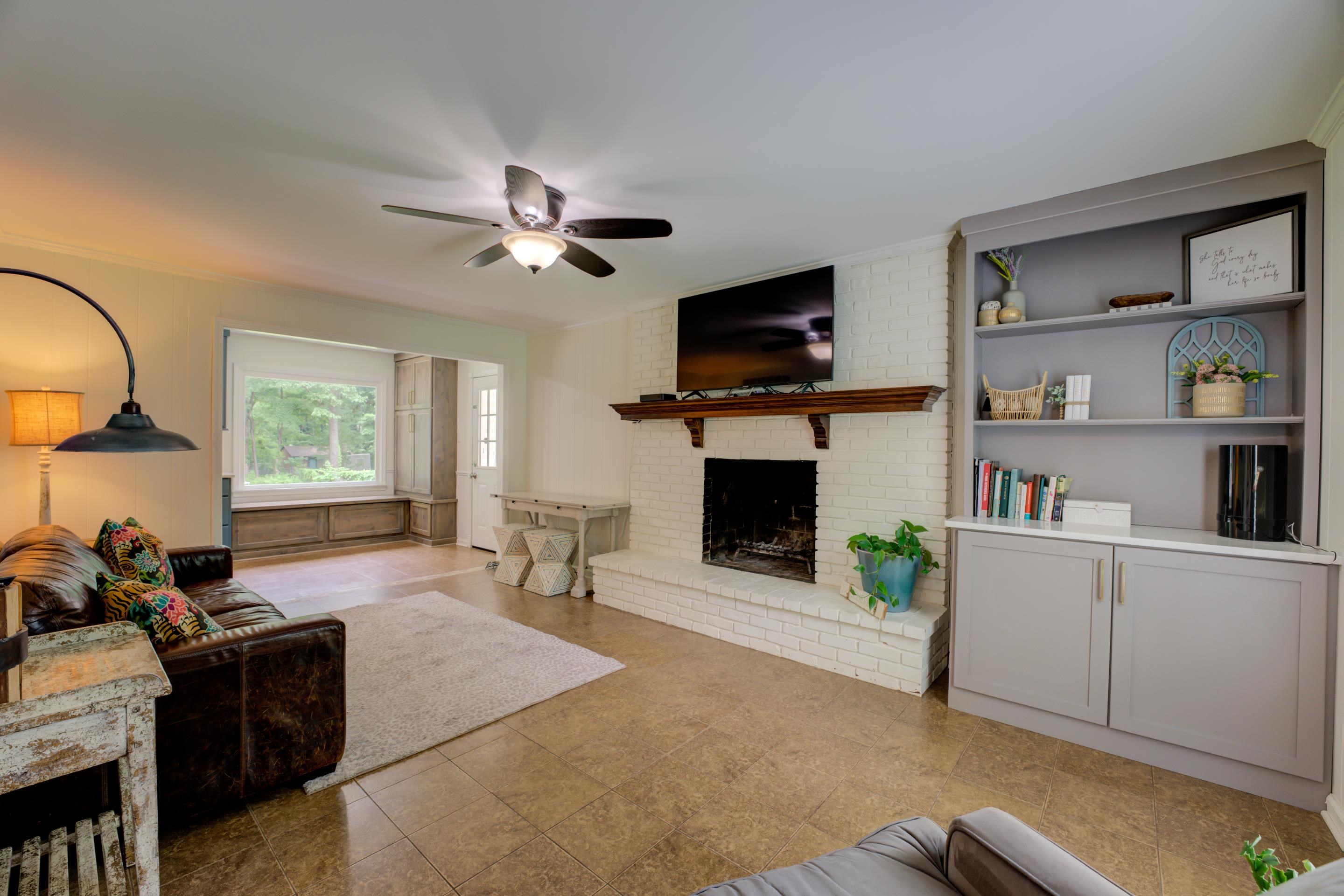 316 Dove Valley Road Collierville, TN 38017 - Photo 7 of 21 a living room with furniture a fireplace and a flat screen tv