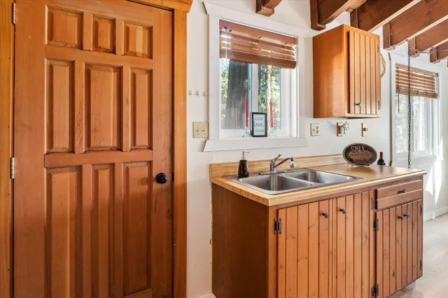 a bathroom with a sink and a window