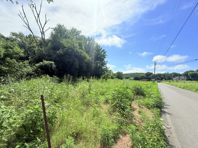a view of a field with an outdoor space