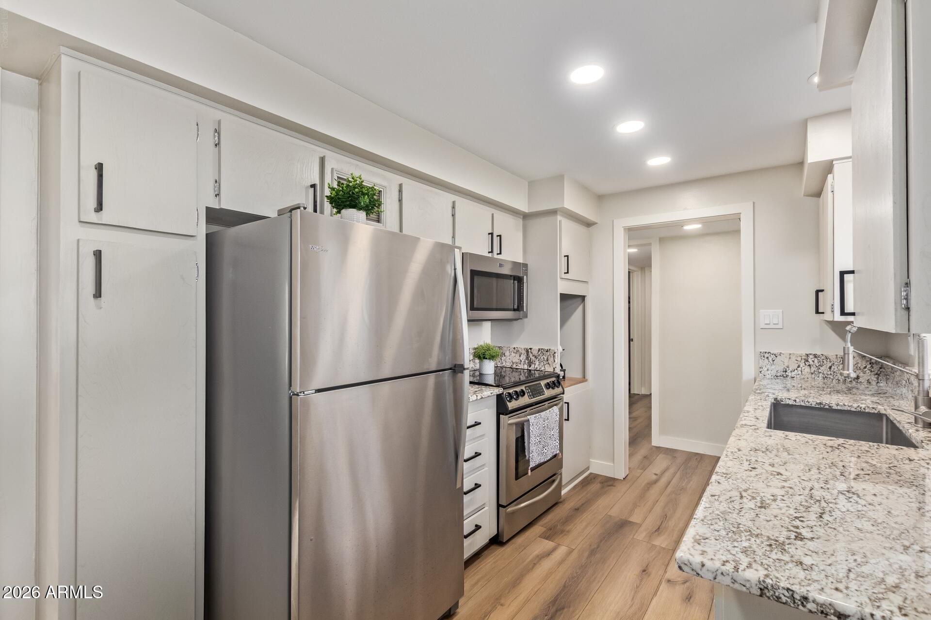 3242 East Camelback Road, Unit 106 Phoenix, AZ 85018 - Photo 6 of 17 Kitchen and storage