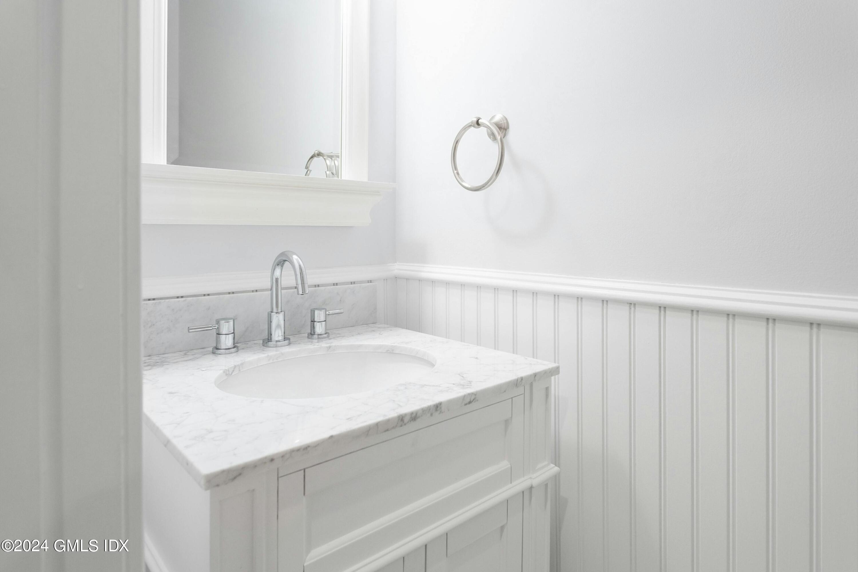 37 Sheep Hill Road, Unit 12 Riverside, CT 06878 - Photo 14 of 23 a bathroom with a sink and a mirror