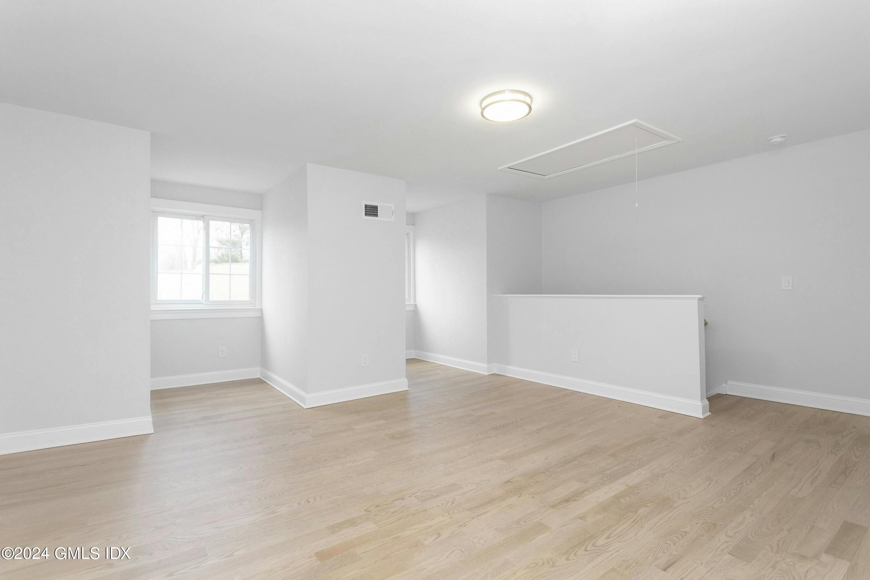 37 Sheep Hill Road, Unit 12 Riverside, CT 06878 - Photo 16 of 23 an empty room with windows