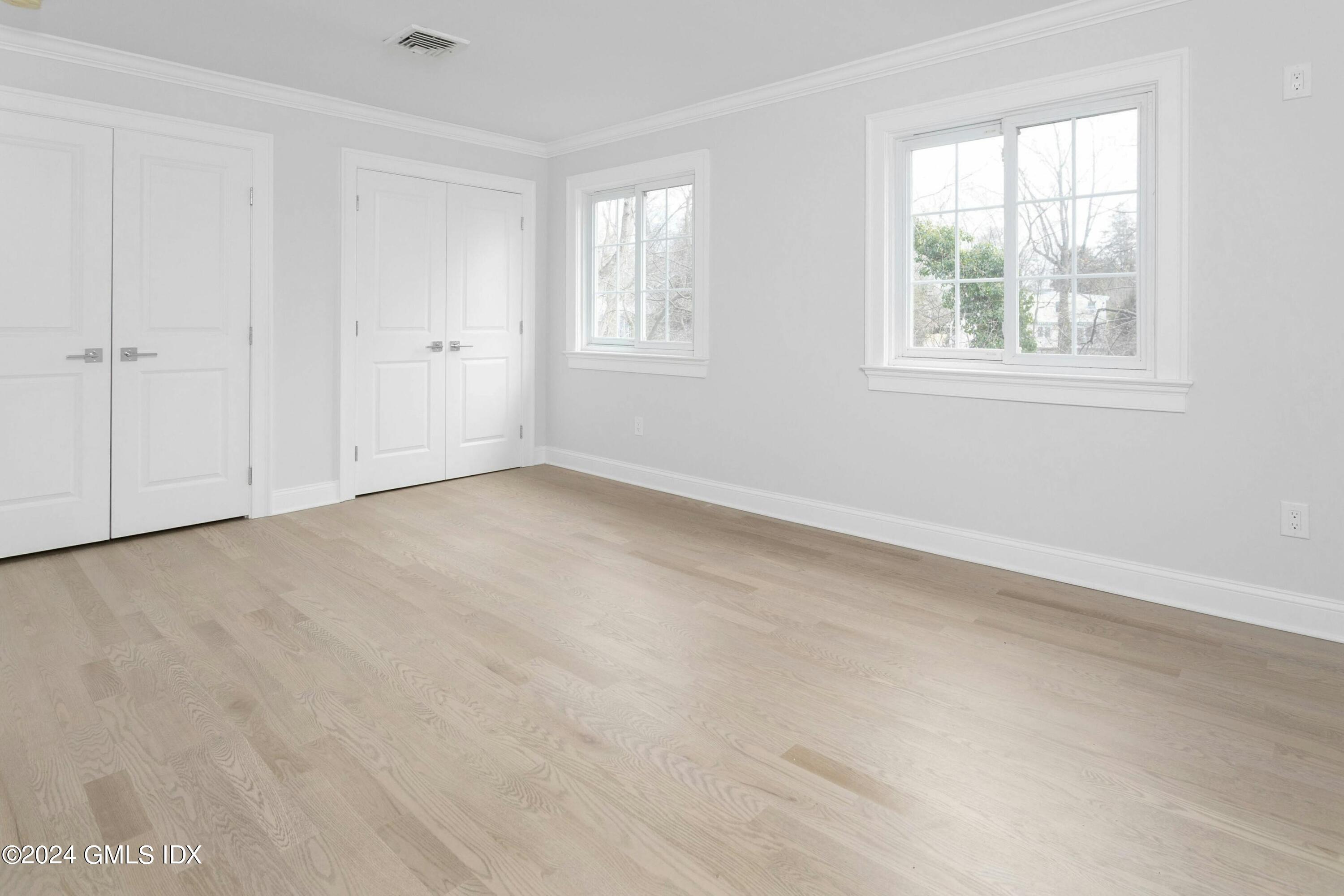 37 Sheep Hill Road, Unit 12 Riverside, CT 06878 - Photo 18 of 23 an empty room with windows