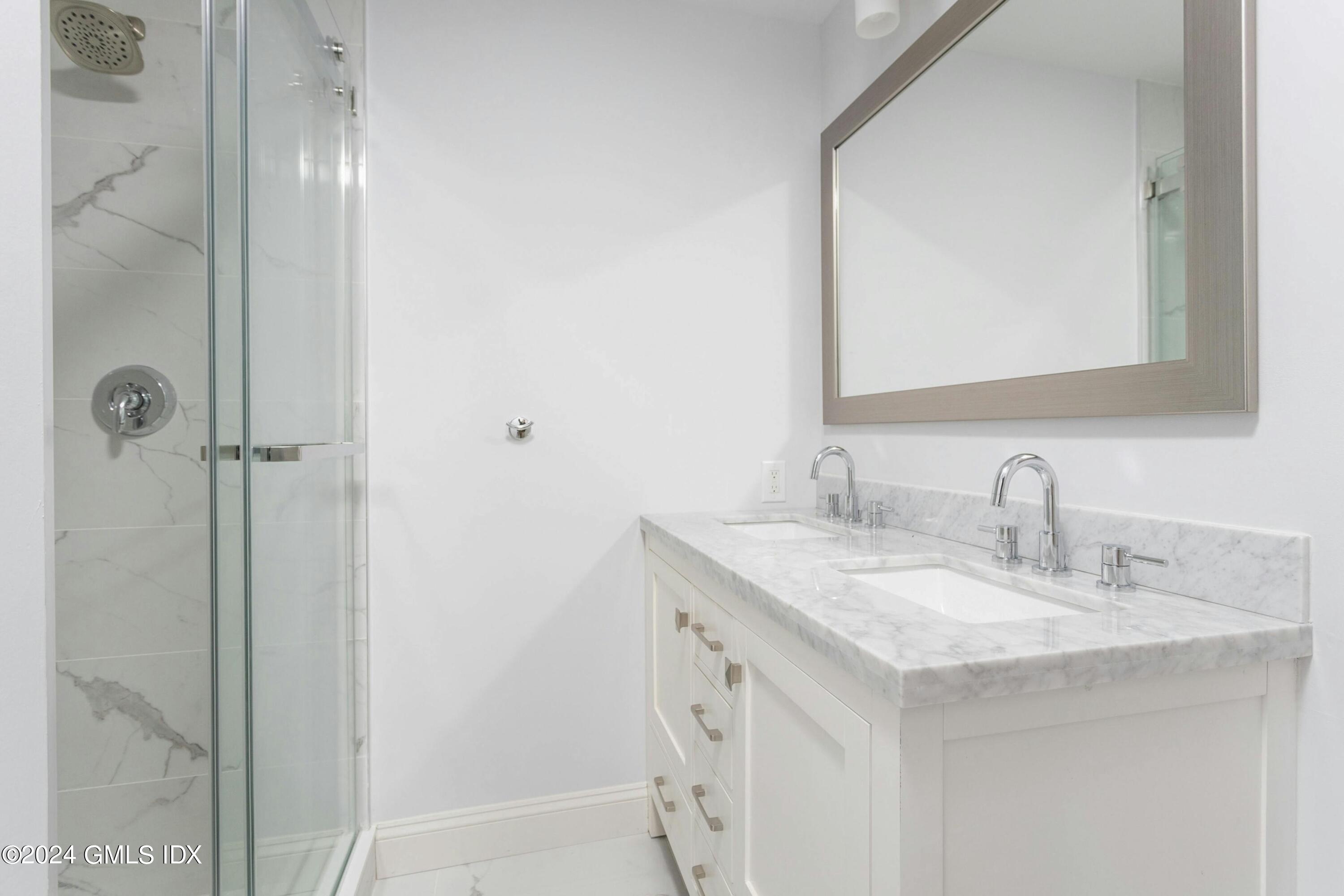 37 Sheep Hill Road, Unit 12 Riverside, CT 06878 - Photo 19 of 23 a bathroom with a sink and a mirror