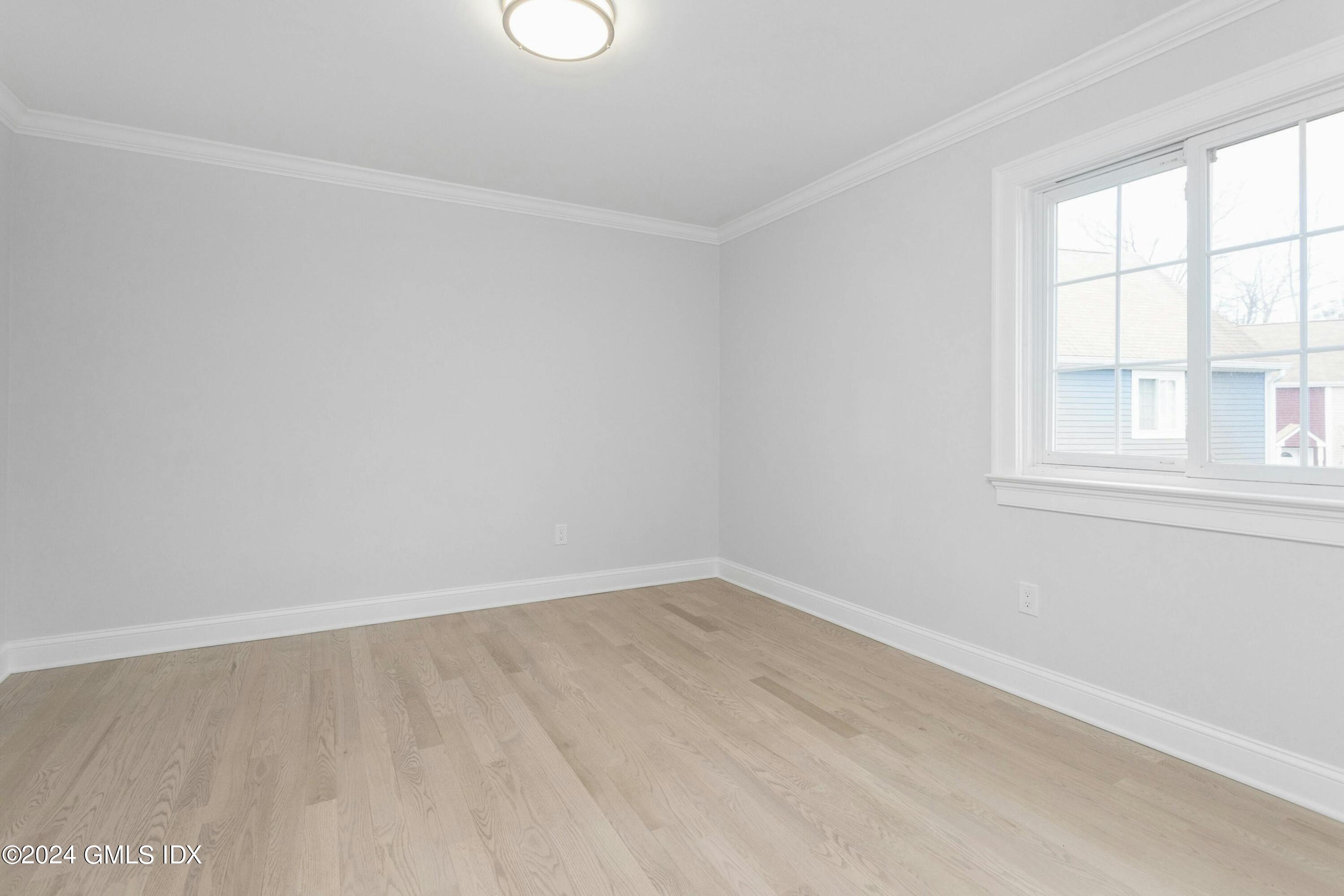 37 Sheep Hill Road, Unit 12 Riverside, CT 06878 - Photo 21 of 23 an empty room with a window