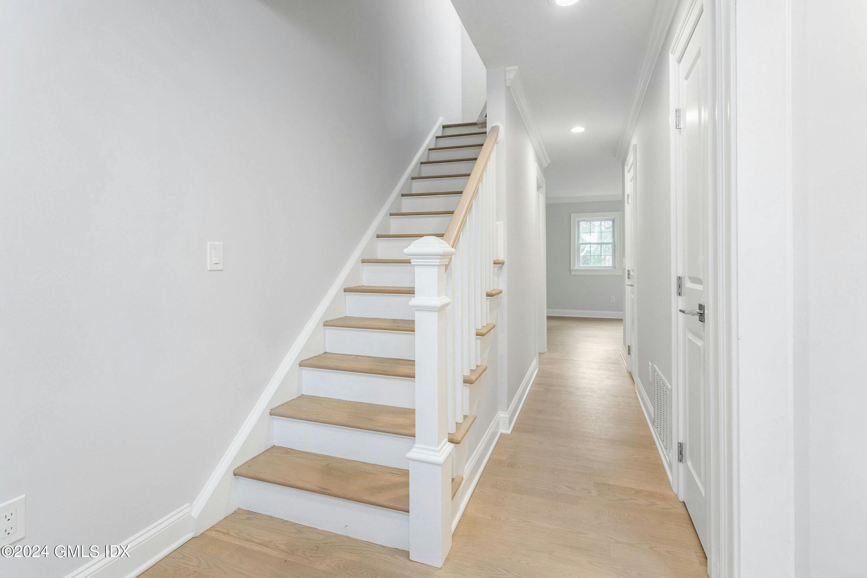 37 Sheep Hill Road, Unit 12 Riverside, CT 06878 - Photo 4 of 23 a view of a hallway with stairs