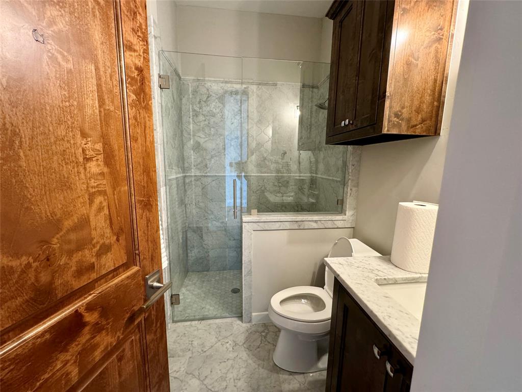 474 Eagle Cove Circle Tioga, TX 76271 - Photo 12 of 26 a bathroom with a toilet sink and shower