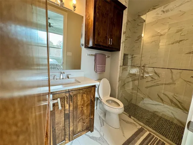 a bathroom with a sink and toilet