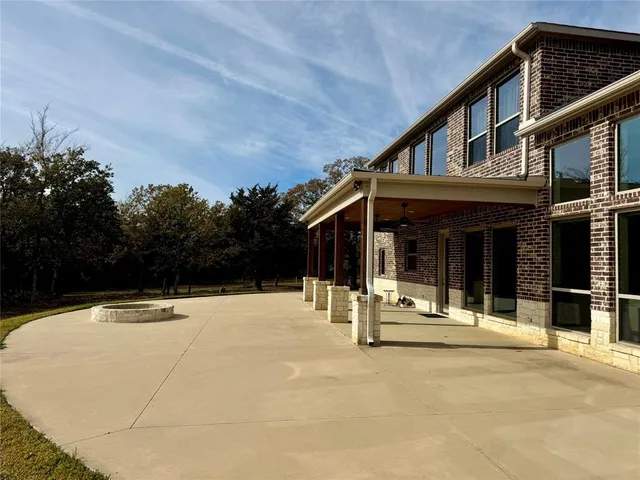 a house with trees in front of it