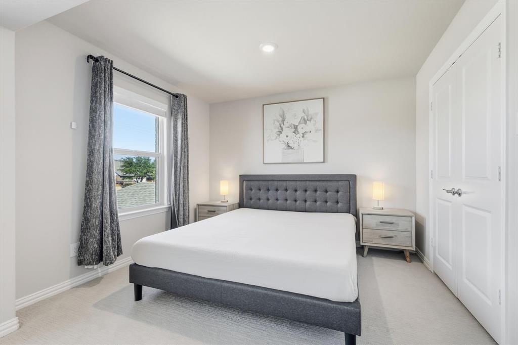 4125 Caprock Canyon Road Sachse, TX 75048 - Photo 16 of 40 a bedroom with a bed and a window