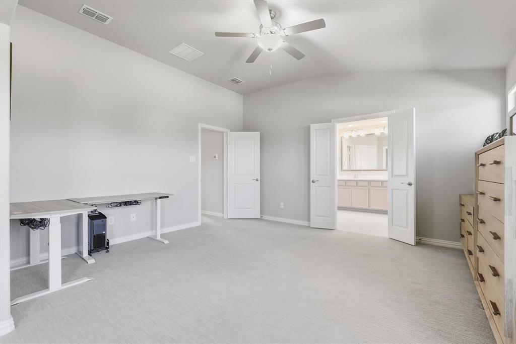 4125 Caprock Canyon Road Sachse, TX 75048 - Photo 17 of 40 wooden floor with white cabinets and window