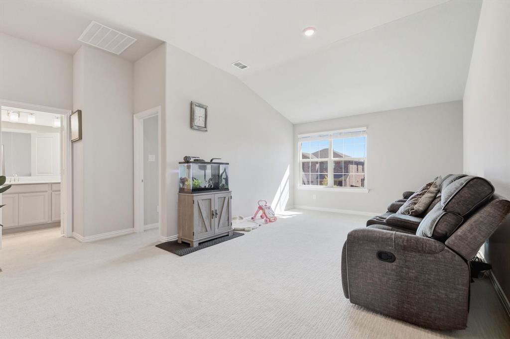 4125 Caprock Canyon Road Sachse, TX 75048 - Photo 22 of 40 a living room with furniture and a window