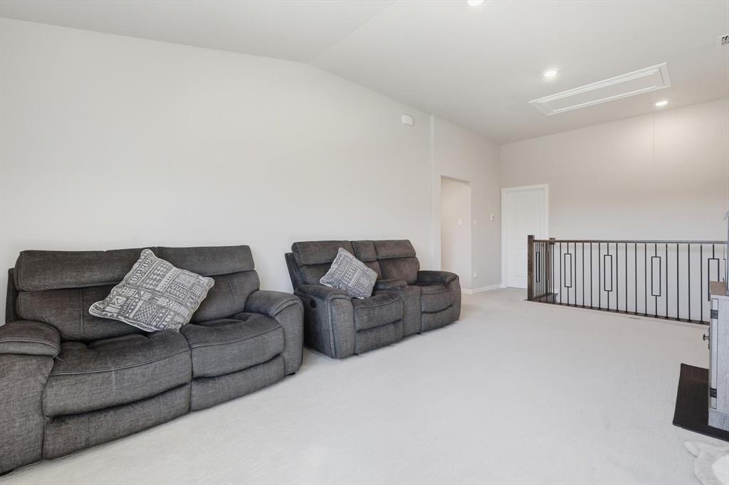 4125 Caprock Canyon Road Sachse, TX 75048 - Photo 23 of 40 a living room with furniture and a couch