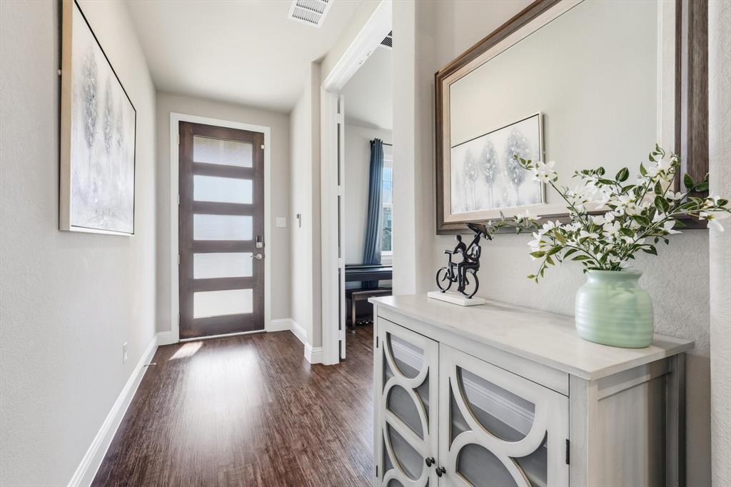 4125 Caprock Canyon Road Sachse, TX 75048 - Photo 3 of 40 a view of living room filled with furniture and wooden floor