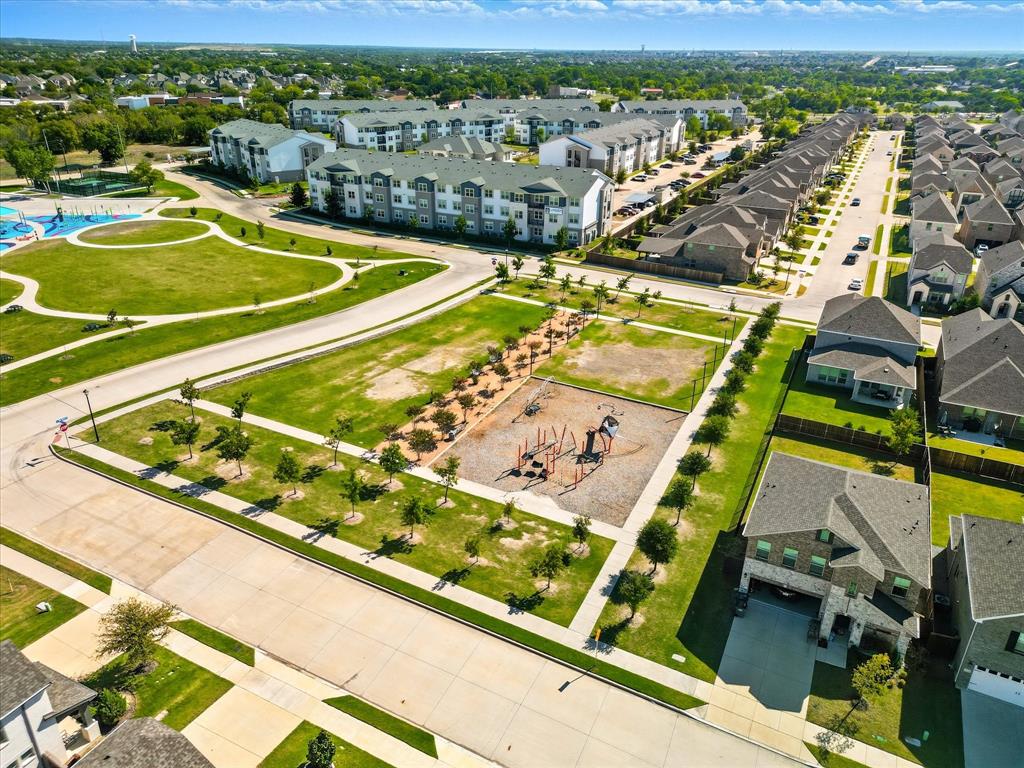 4125 Caprock Canyon Road Sachse, TX 75048 - Photo 33 of 40 a view of a pool with a table and chairs